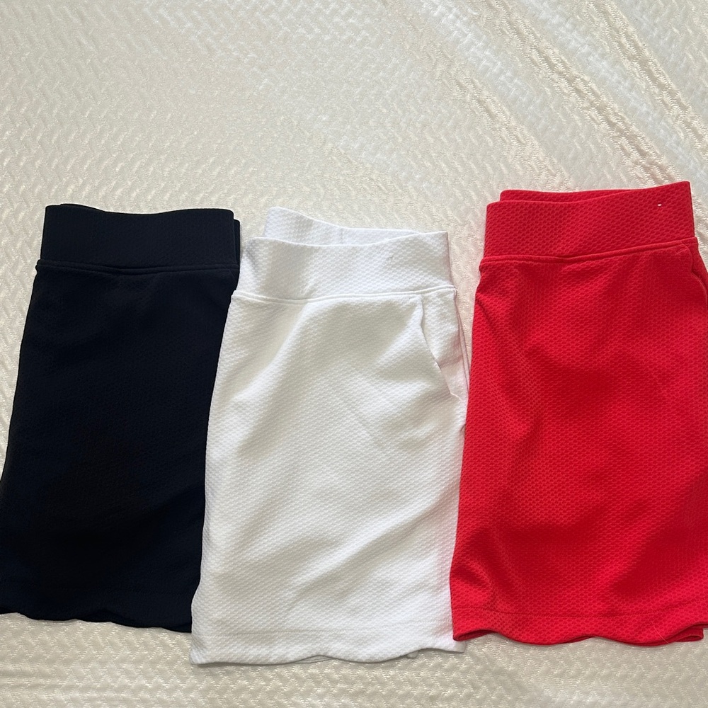 Elegant Women's Golf Skort Trio - Black, White, and Red